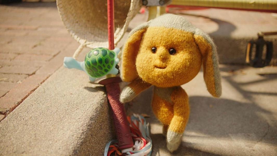 Afbeelding van Dropje. Een gele personnage met konijnenoren.